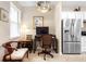 Cozy home office with desk and comfortable seating, complemented by ample natural light at 1028 Salamanca Pl, Davenport, FL 33837