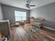bedroom featuring a crib, play area, and plenty of room for toys and activities at 10549 Cypress Trail Dr, Orlando, FL 32825