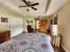 Well-lit bedroom features ceiling fan, a spacious closet, and lots of natural light at 10549 Cypress Trail Dr, Orlando, FL 32825