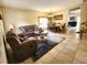 Inviting living room with comfortable seating, a decorative rug, and ample natural light at 10549 Cypress Trail Dr, Orlando, FL 32825