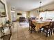 Open-concept living and dining area with tile floors and stylish furnishings at 10549 Cypress Trail Dr, Orlando, FL 32825