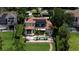 Aerial view of a beautiful property, showcasing the backyard pool and lush landscaping at 11018 Lake Butler Blvd, Windermere, FL 34786