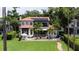Expansive backyard features a pristine lawn, patio, pool, and lush landscaping for outdoor enjoyment at 11018 Lake Butler Blvd, Windermere, FL 34786