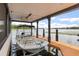 Modern boat dock featuring a covered boat lift, offering convenience and protection for your watercraft at 11018 Lake Butler Blvd, Windermere, FL 34786