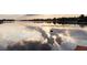 Serene lake reflecting the sky with calm waters and a hint of the setting sun at 11018 Lake Butler Blvd, Windermere, FL 34786