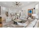 Bright and open living room with a staircase, leading to the kitchen at 11018 Lake Butler Blvd, Windermere, FL 34786