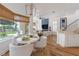 Open living space features a breakfast nook, fireplace, and views of the pool and lake at 11018 Lake Butler Blvd, Windermere, FL 34786
