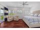 Spacious main bedroom with hardwood floors, sitting area, and natural light at 11018 Lake Butler Blvd, Windermere, FL 34786