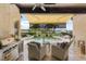 Outdoor seating and kitchen area with a view of the pool and lake at 11018 Lake Butler Blvd, Windermere, FL 34786