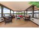 Relaxing screened porch with comfortable seating, offering serene lake views and outdoor living at 11018 Lake Butler Blvd, Windermere, FL 34786