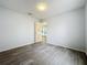 This bedroom boasts wood-look floors and neutral walls, creating a calming space at 1113 Woodman Way, Orlando, FL 32818