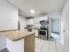 Kitchen with stainless steel appliances at 1113 Woodman Way, Orlando, FL 32818