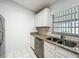 Cozy kitchen area showcases stainless steel appliances and granite countertops at 1113 Woodman Way, Orlando, FL 32818