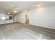 Well-lit kitchen with stainless steel appliances, granite counters, and ample cabinet space with neutral walls at 1113 Woodman Way, Orlando, FL 32818