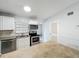 Bright kitchen with stainless steel appliances, granite counters, and ample cabinet space to maximize storage at 1113 Woodman Way, Orlando, FL 32818
