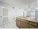 View of the living room overlooking the kitchen area at 1113 Woodman Way, Orlando, FL 32818