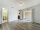 Living room overlooking the bathroom, kitchen, and patio at 1113 Woodman Way, Orlando, FL 32818