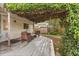 Backyard featuring a covered patio with outdoor furniture and lush landscaped grounds at 1135 Thunder Trl, Maitland, FL 32751
