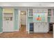 Charming bar area features custom cabinets, wine storage, and unique brick flooring at 1135 Thunder Trl, Maitland, FL 32751