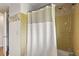 Bathroom with tiled walls, shower and tub, and a towel rack at 1135 Thunder Trl, Maitland, FL 32751