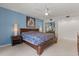 Bedroom featuring a ceiling fan and closet with mirrored doors at 1135 Thunder Trl, Maitland, FL 32751