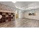 Spacious bonus room with wood floors, decorative wallpaper, and ample storage at 1135 Thunder Trl, Maitland, FL 32751