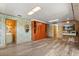 Large bonus room with wood floors, ample built-in storage, and multiple entryways at 1135 Thunder Trl, Maitland, FL 32751