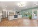 Bright kitchen with large island, stainless steel refrigerator, and backyard view at 1135 Thunder Trl, Maitland, FL 32751
