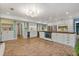 Expansive kitchen with custom cabinets, wood counters, stainless appliances, and brick flooring at 1135 Thunder Trl, Maitland, FL 32751