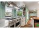 Well-equipped kitchen with a professional grade stove, ample counter space, and open shelving at 1135 Thunder Trl, Maitland, FL 32751