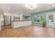Bright kitchen offers ample cabinet space, stainless steel appliances, brick flooring, and an adjacent dining area at 1135 Thunder Trl, Maitland, FL 32751