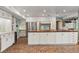 Bright kitchen featuring custom cabinetry, stainless steel appliances, and brick flooring for a unique design at 1135 Thunder Trl, Maitland, FL 32751