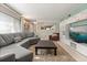 Spacious living room with a large sectional sofa and built-in shelving for storage at 1135 Thunder Trl, Maitland, FL 32751