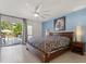 Spacious main bedroom with direct access to an outdoor patio and a view of the pool at 1135 Thunder Trl, Maitland, FL 32751
