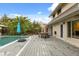 Backyard view of a pool and deck with dining area, showcasing an outdoor living space at 1135 Thunder Trl, Maitland, FL 32751