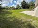 A expansive backyard includes a brick patio and partial fence at 1139 Poppy Ave, Orlando, FL 32811