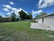 Spacious backyard with green grass and newly installed brick patio at 1139 Poppy Ave, Orlando, FL 32811