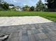 Backyard with a gray brick patio and green lawn at 1139 Poppy Ave, Orlando, FL 32811