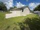 The backyard includes a brick patio, access to the home, and a partial fence at 1139 Poppy Ave, Orlando, FL 32811