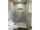 Updated bathroom featuring a tiled shower with a built-in niche at 1139 Poppy Ave, Orlando, FL 32811