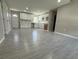 Open concept kitchen with white cabinets and light gray tile floors at 1139 Poppy Ave, Orlando, FL 32811