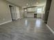 Open concept kitchen with white cabinets and light gray tile floors at 1139 Poppy Ave, Orlando, FL 32811