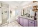 Stylish bathroom with a double sink vanity, a soaking tub, a separate shower, and modern fixtures at 1221 N Brickell Dr, Deltona, FL 32725