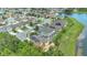 Real estate with a lovely neighborhood near a tranquil lake, landscaped yards, and stunning aerial views at 15659 Carina Dr, Orlando, FL 32828