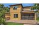 A backyard and a home with a screened patio, brick patio, and lots of nature at 15659 Carina Dr, Orlando, FL 32828