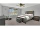Comfortable bedroom with a large window and neutral color scheme at 15659 Carina Dr, Orlando, FL 32828