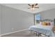 This bedroom features a large window for natural light and a sleek black metal bed frame at 15659 Carina Dr, Orlando, FL 32828