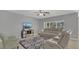 Cozy living room with plush seating, patterned rug, and a ceiling fan at 15659 Carina Dr, Orlando, FL 32828