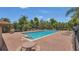 Beautiful community pool with lounge chairs and tables, perfect for relaxation and socializing in a brick-paved pool area at 15659 Carina Dr, Orlando, FL 32828