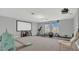Large recreation room with fitness equipment and a projector screen, ideal for entertainment at 15659 Carina Dr, Orlando, FL 32828